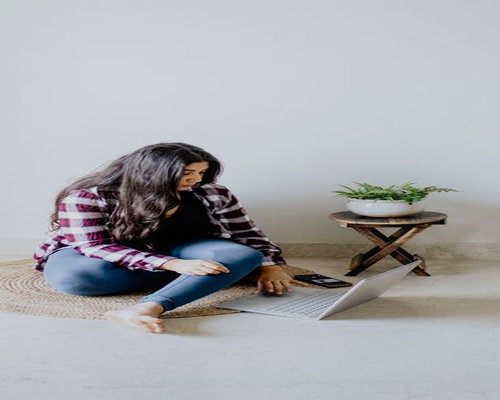 Person working on a laptop at home in India